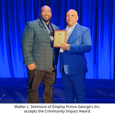 Walter L. Simmons of Employ Prince Georges Inc. accepts the Community Impact Award. (3)